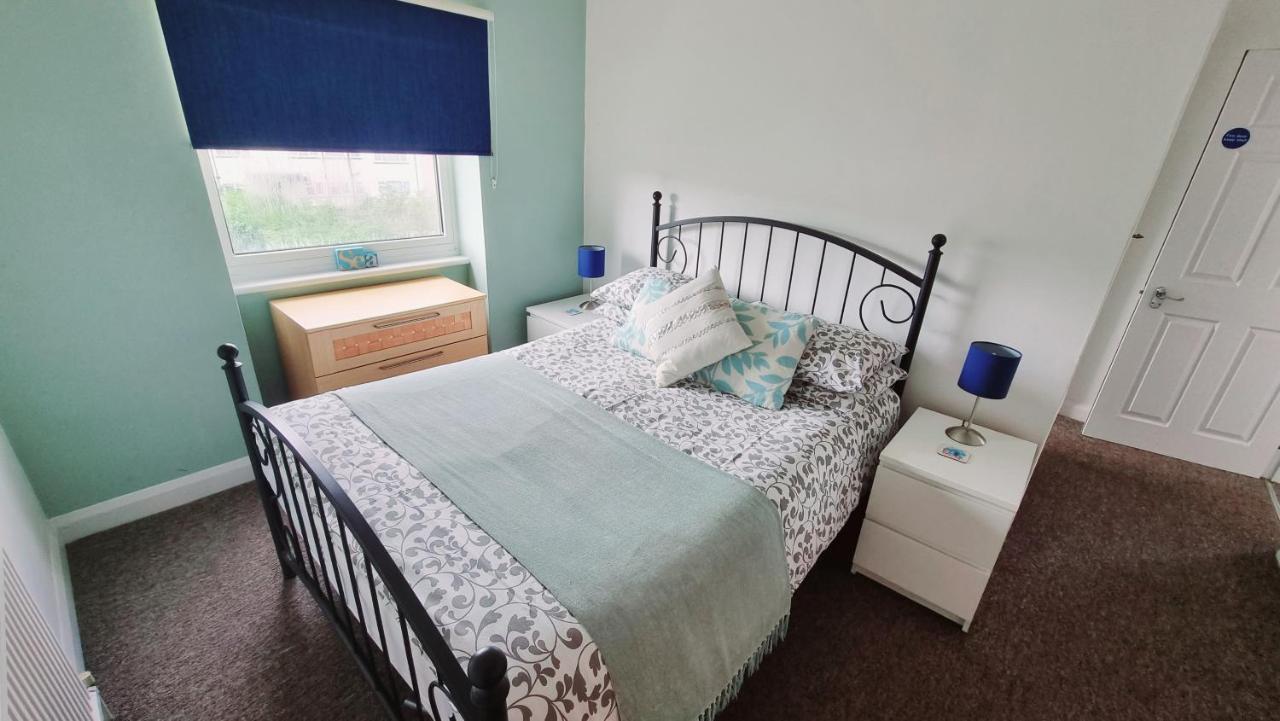 บีชคอมเบอร์ ฮอลิเดย์ อพาร์ตเมนต์ Apartment สวาเนจ ภายนอก รูปภาพ