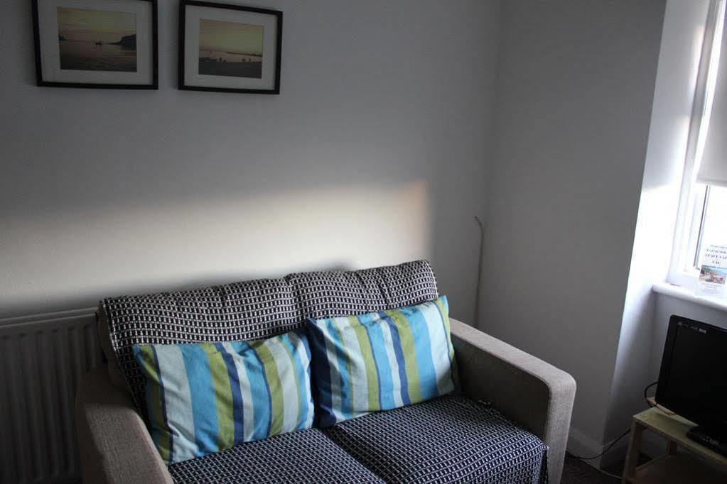 บีชคอมเบอร์ ฮอลิเดย์ อพาร์ตเมนต์ Apartment สวาเนจ ภายนอก รูปภาพ